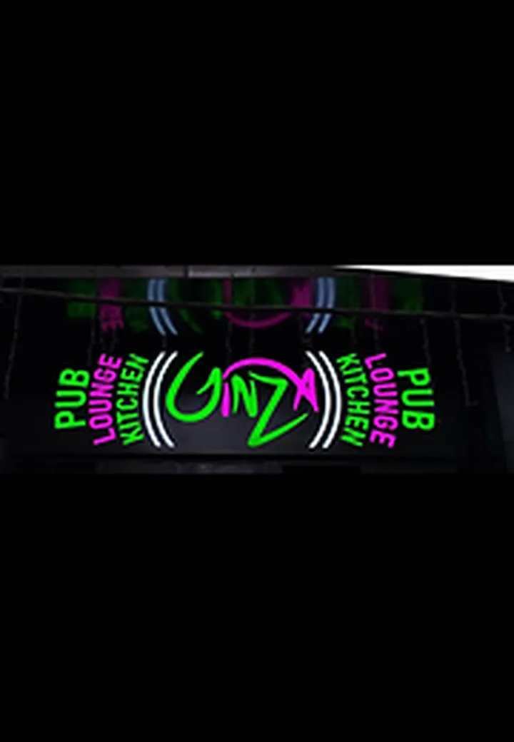Green and pink 2D LED sign board with neon lettering for Ginza pub and lounge at night